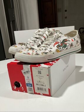 Row One White Low-Top Sneakers with Green & Orange Graphic Accents